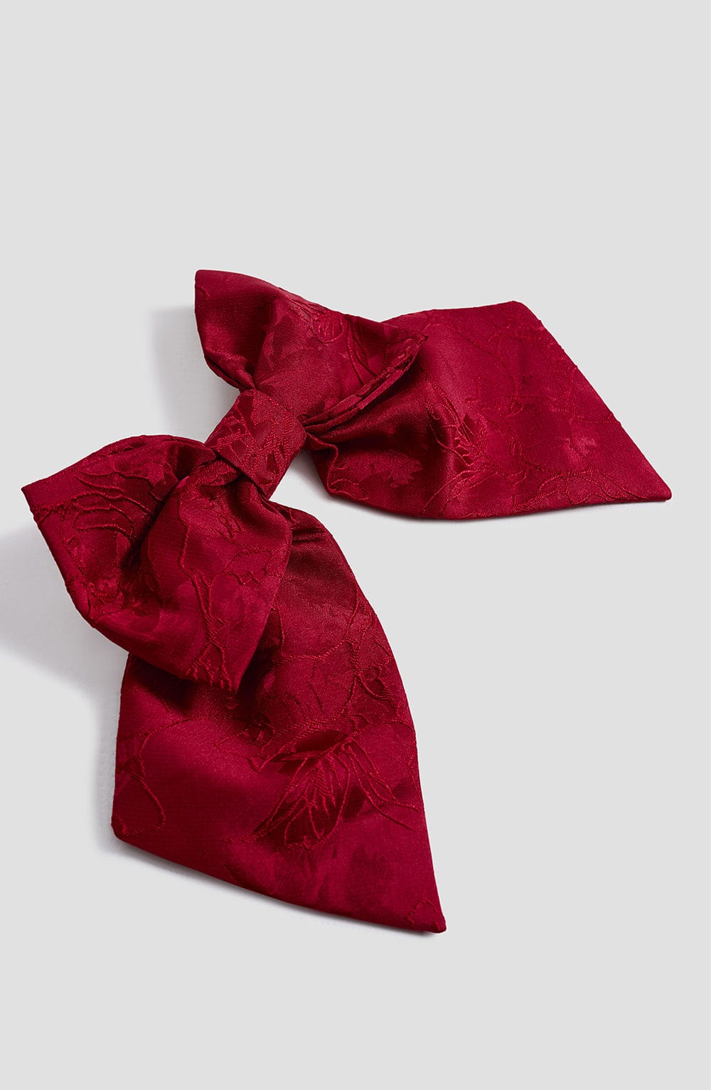 Par de lazos rojos de tela con moño grande, diseño con relieve