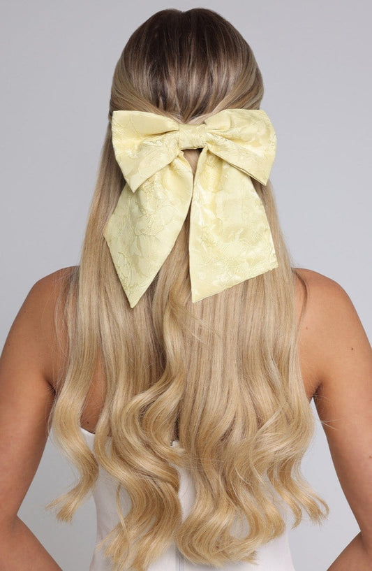 Lazo para el cabello amarillo limón con moño grande y doble nudo trasero