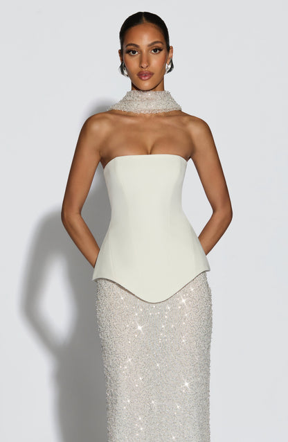 Corsé marfil sin tirantes con peplum y falda larga de lentejuelas